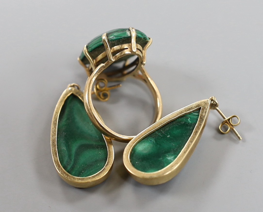 A 9ct gold and malachite set oval ring, size P/Q and a pair of similar earrings, gross weight 20.4 grams.
